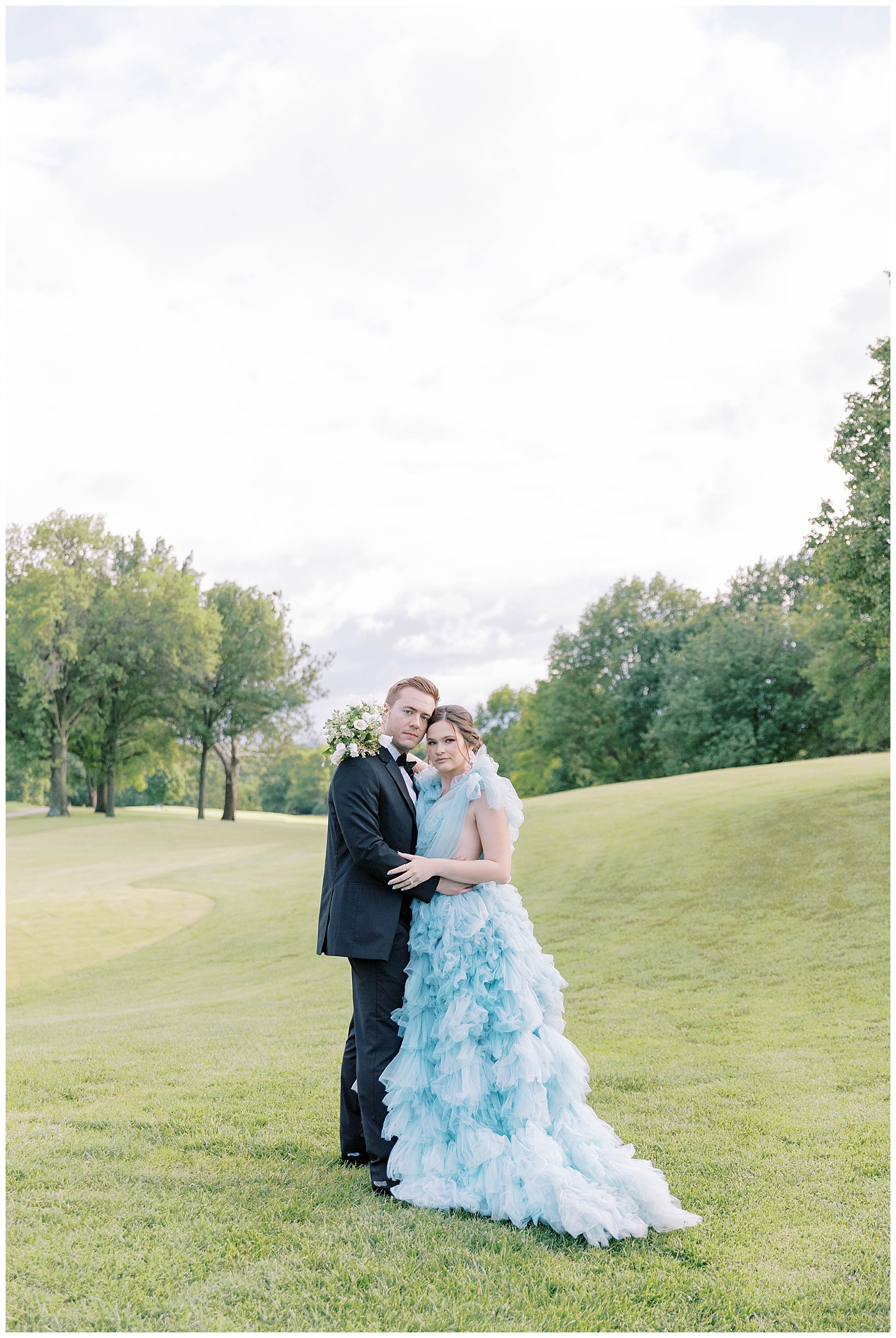 bride and groom oakwood country club kansas city wedding millia london blue willow gown
